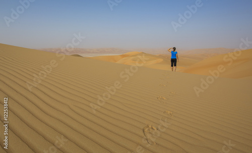 Woman walking in a desert