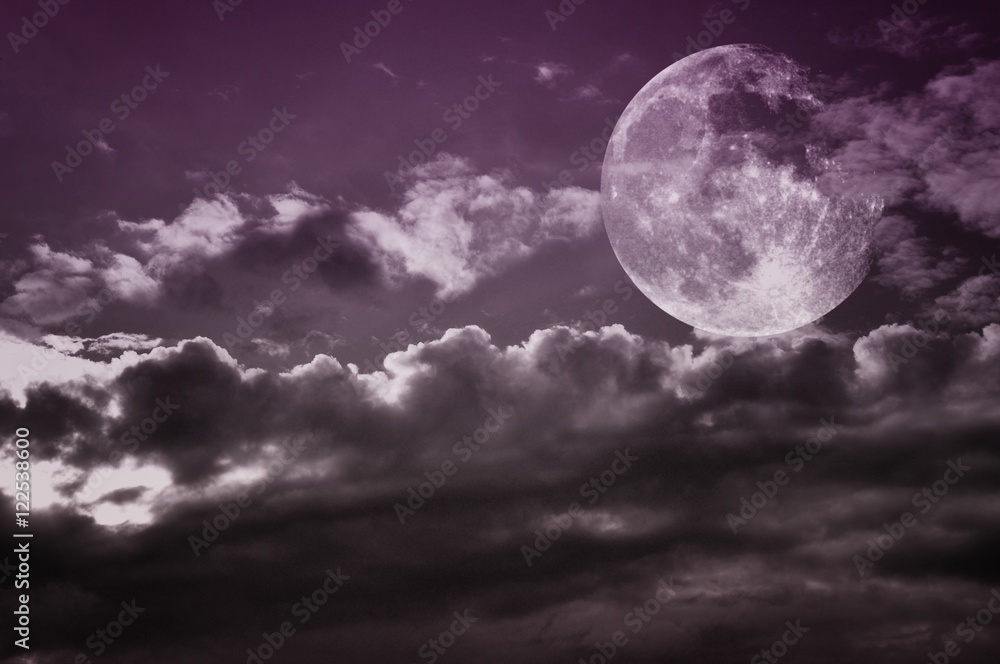 Vintage cloudy sky with full moon. Moon image courtesy NASA.
