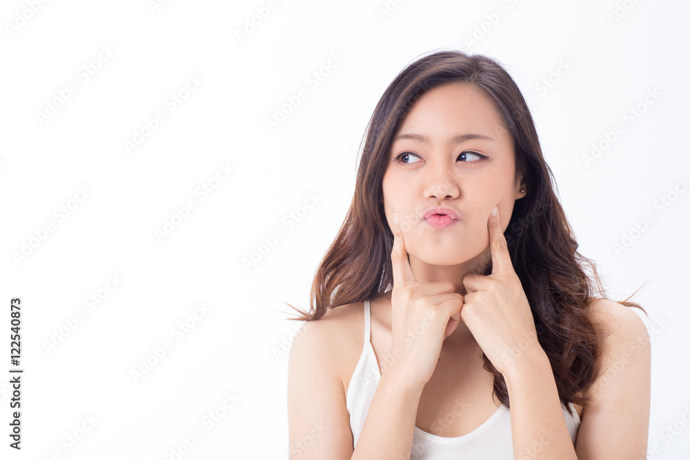 An Asian pretty clean face girl making funny face showing her skin An Asian pretty clean face girl making funny face showing her skin