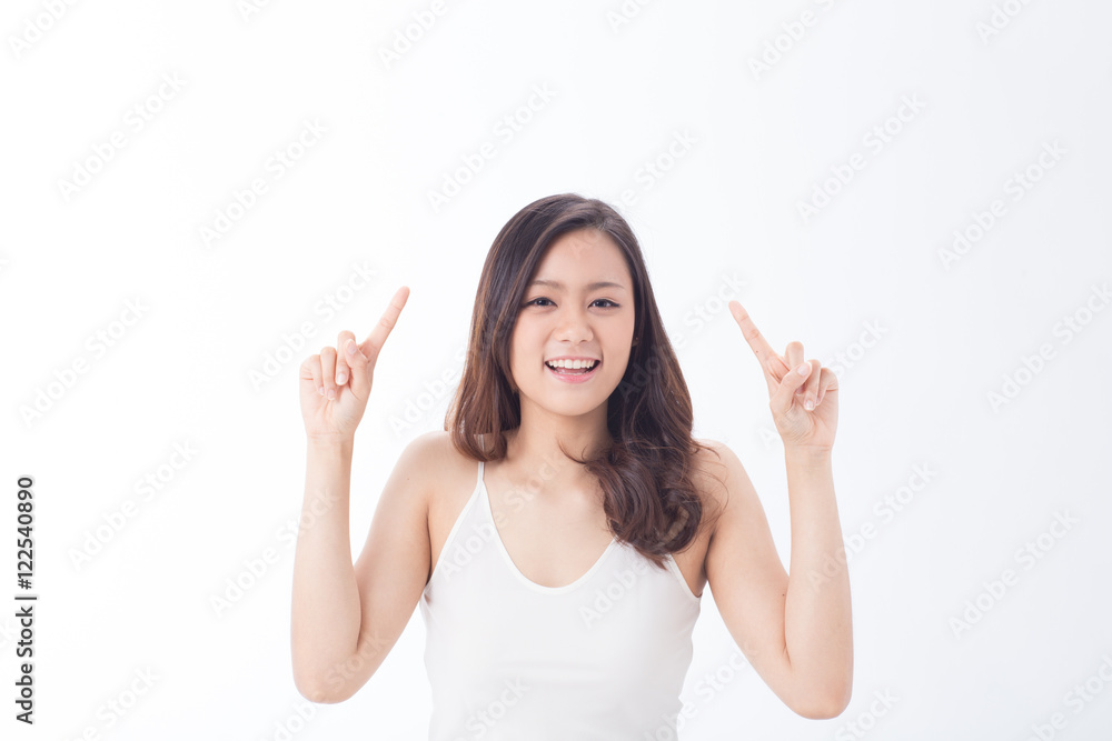 Cute Asian teenage girl with perfect skin Portrait showing empty copy space on the upper pointing hands for text on white background. Cute Asian teenage girl with perfect skin Portrait showing empty copy space on the upper pointing hands for text on white background.