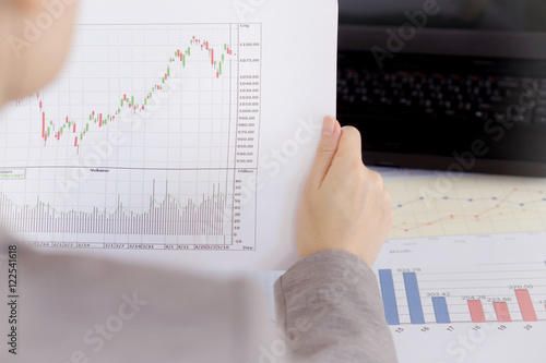 Businesswoman Looking At Financial Report