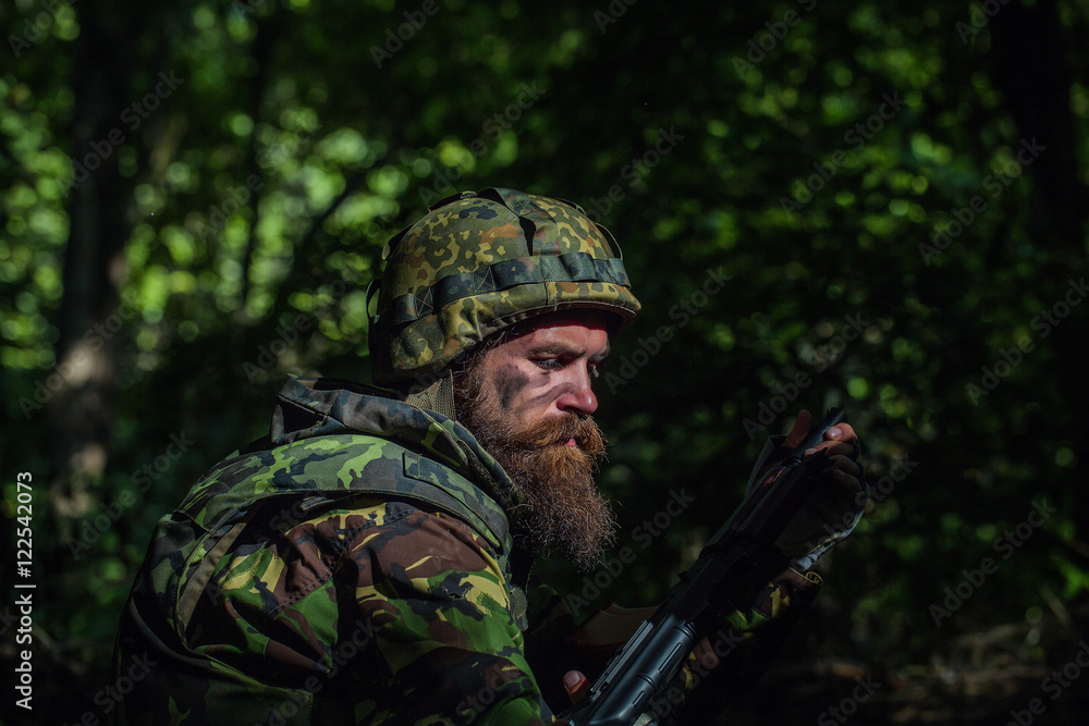 Young soldier with gun