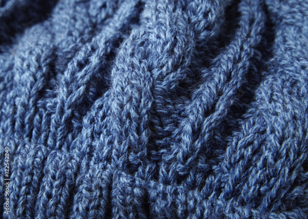 A full page close up of blue cable knit sweater background texture