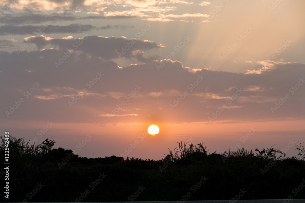 Fototapeta premium Sunset with clouds, light rays