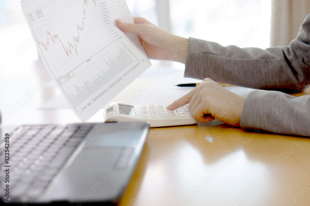 Picture of businesswoman with financial report at office (focus Picture of businesswoman with financial report at office (focus