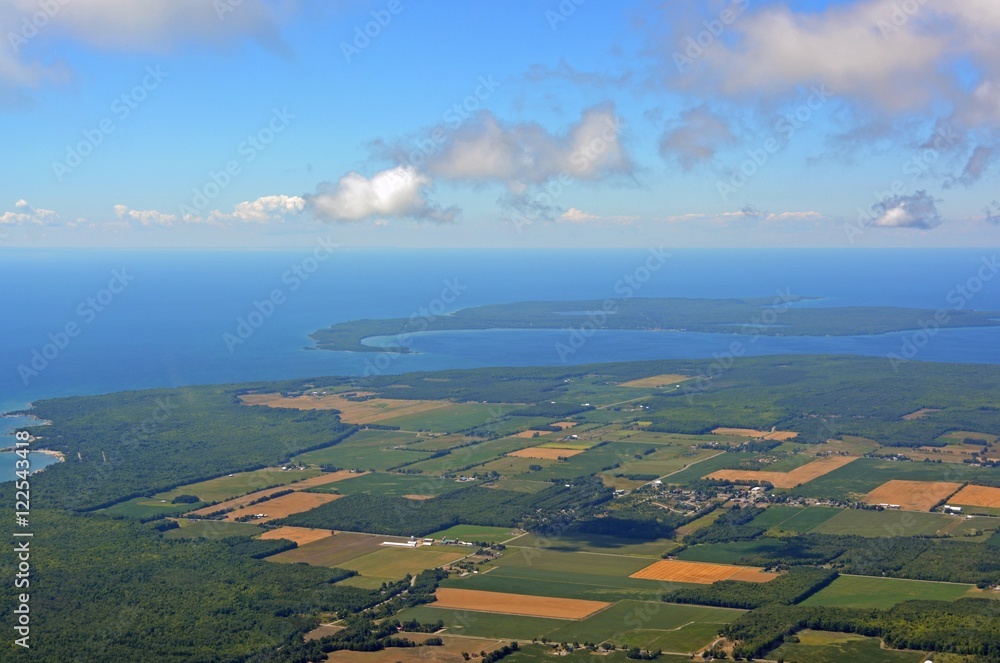 Obraz premium aerial view of the town of Laurin located at the Georgian Bay Christian Island in the background, Ontario Canada 