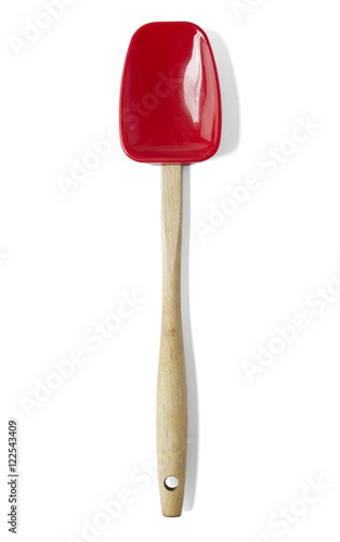 A red silicone and wooden spatula isolated on a white background