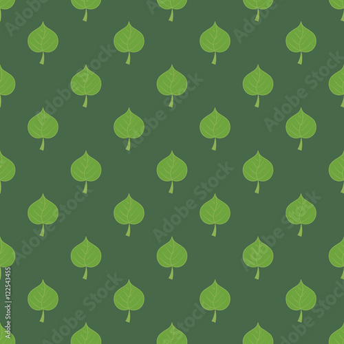 Leaves of linden on dark green background seamless pattern