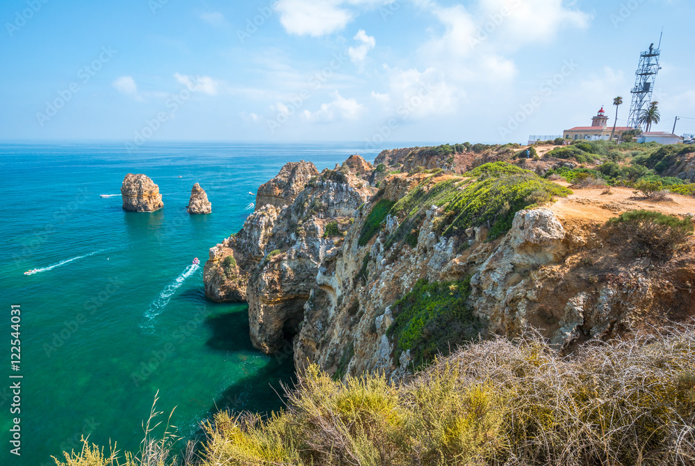 Scenic golden cliffs and emerald water in Ponta da Piedade, Lagos, Algarve, Portugal Scenic golden cliffs and emerald water in Ponta da Piedade, Lagos, Algarve, Portugal