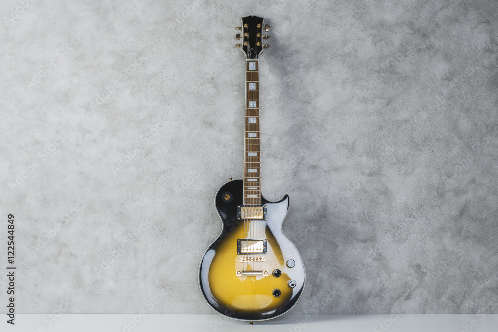 Electric guitar on concrete background
