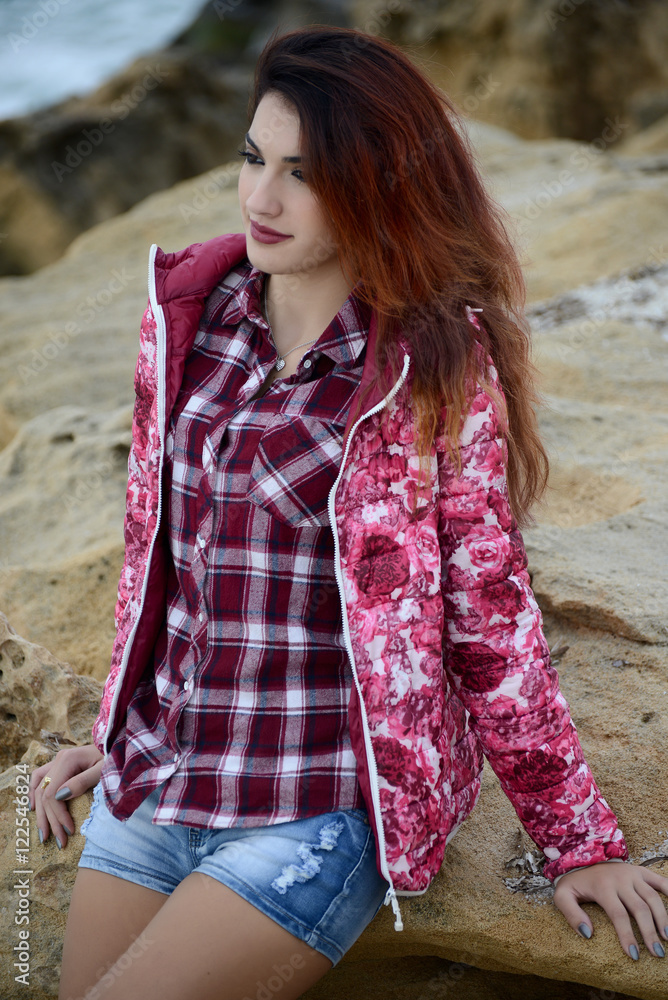 beautiful girl with colorful windbreaker by the sea beautiful girl with colorful windbreaker by the sea
