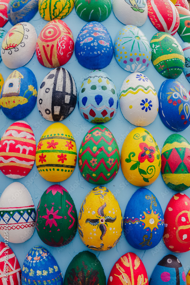 Painted wooden eggs, background.