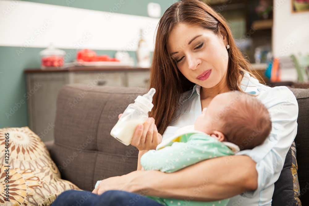 Attractive brunette feeding her baby Attractive brunette feeding her baby