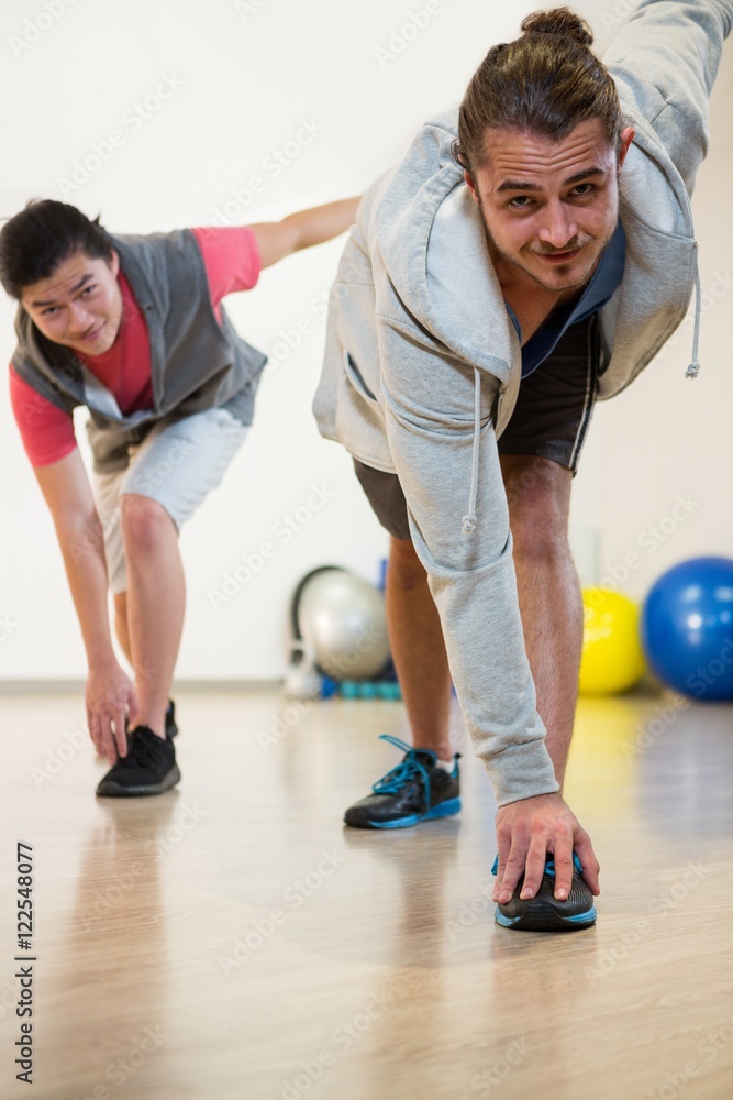 Naklejka premium Men performing stretching exercise