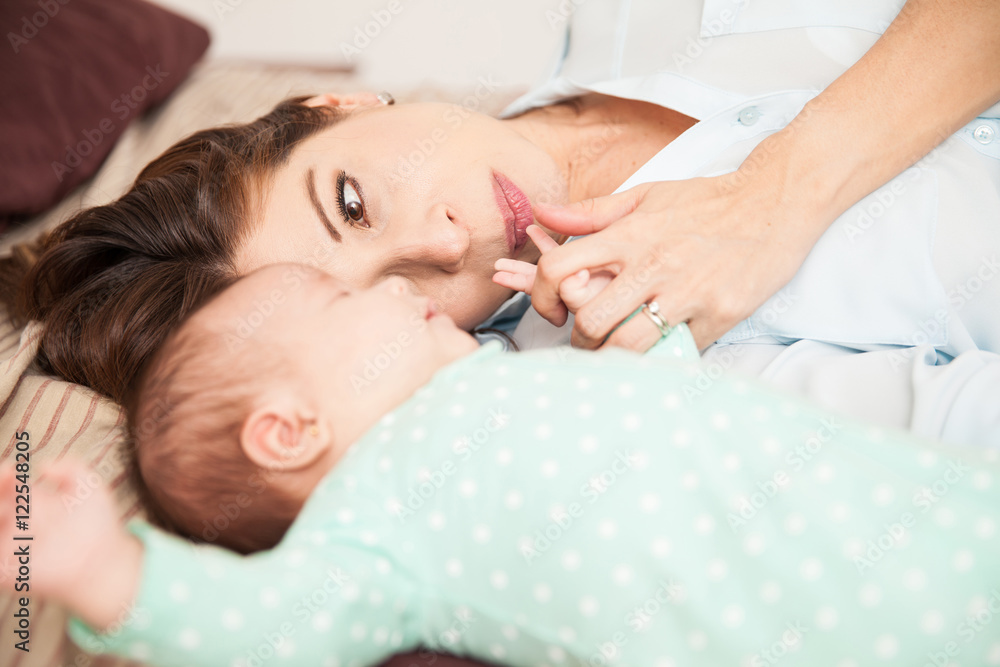 Mother looking at her newborn baby Mother looking at her newborn baby