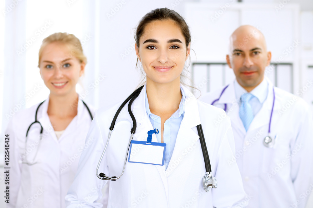 Happy doctor woman with medical staff at the hospital Happy doctor woman with medical staff at the hospital