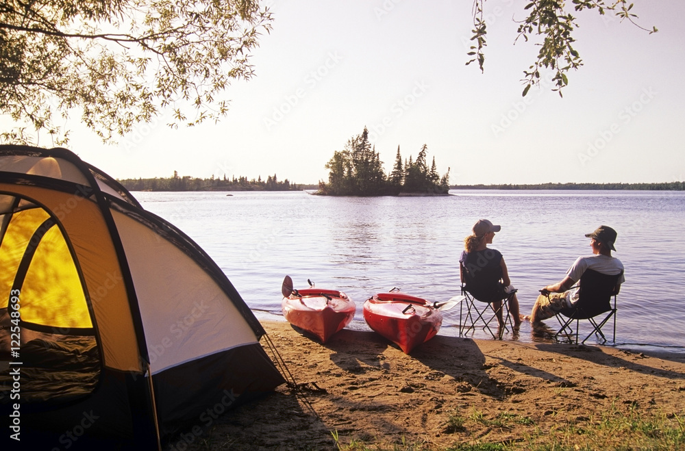 Couple relaxing at Otter Falls campground Whiteshell Provincial Park,  Manitoba, Canada. Stock-Foto | Adobe Stock