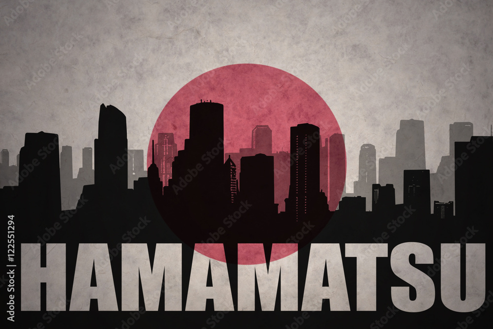 abstract silhouette of the city with text Hamamatsu at the vintage japanese flag background