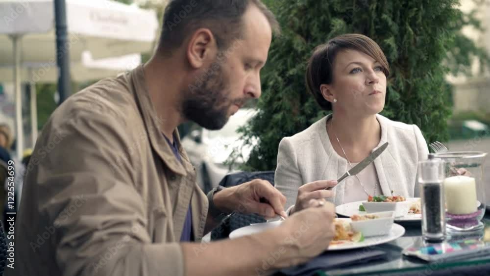 Young couple eating food in cafe, 4K
Young couple eating food in cafe, 4K