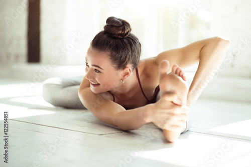 Joyful talented woman doing the splits