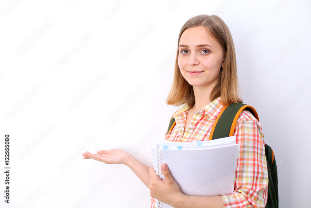 Happy young student girl holding books, study, education, knowledge, goal concept Happy young student girl holding books, study, education, knowledge, goal concept