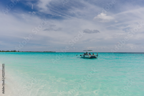 The boat in t the Caribbean Sea and the view of the beach of Cayo Largo, Cuba out of the water © vladimir krupenkin