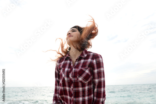 happy beautiful young woman shaking hair
