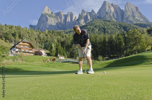 Golfclub St.Vigil Seis, Kastelruth, with Dolomite Mountains in background, Italy photo