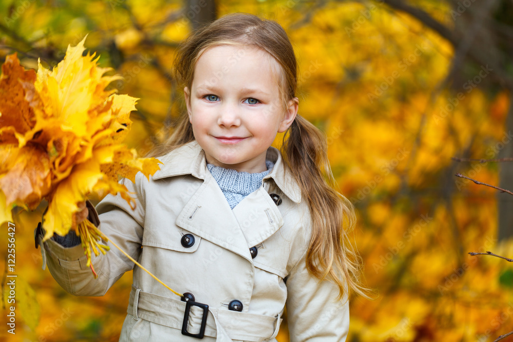 Little girl outdoors at autumn day Little girl outdoors at autumn day