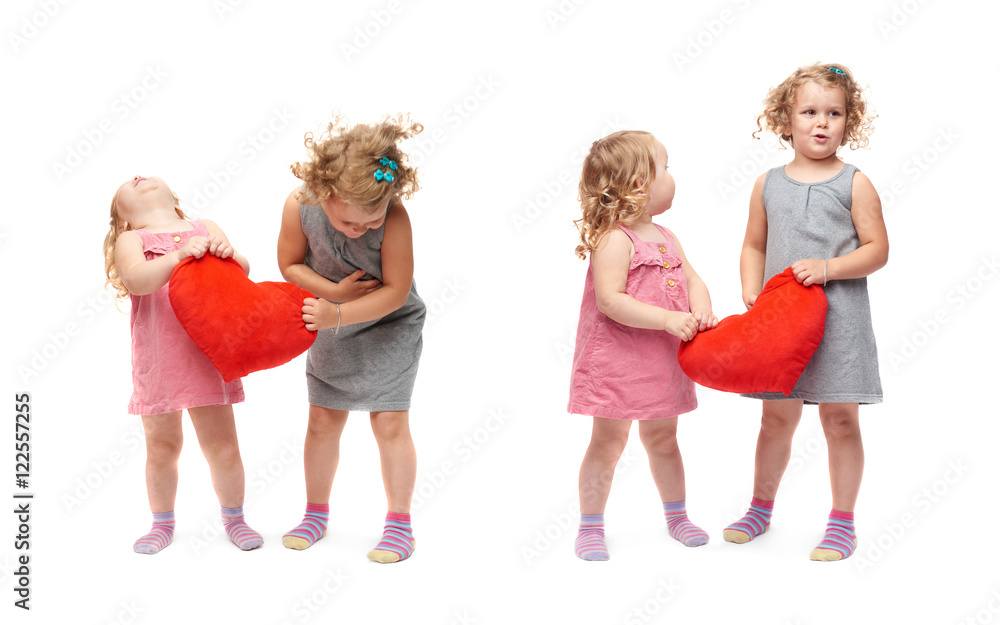 Couple of young little girls standing over isolated white background Couple of young little girls standing over isolated white background