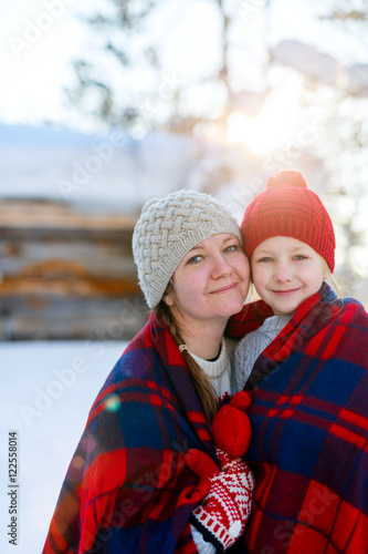 Mother and daughter outdoors on winter