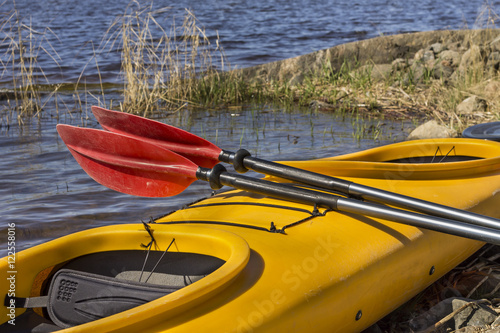 plastic kayak and paddle around the water