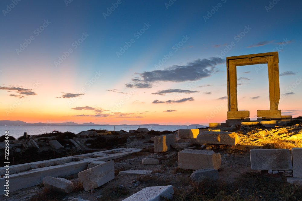 View of Portara and remains of temple of Apollo at sunset. View of Portara and remains of temple of Apollo at sunset.