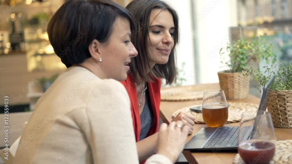 Two girlfriends talking over laptop in cafe in the city, 4K
Two girlfriends talking over laptop in cafe in the city, 4K