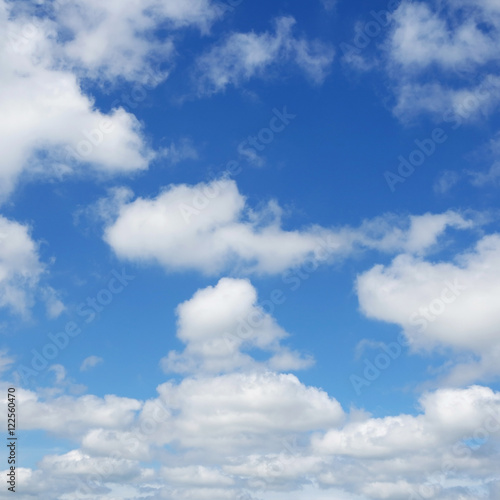 White clouds flying against blue sky.