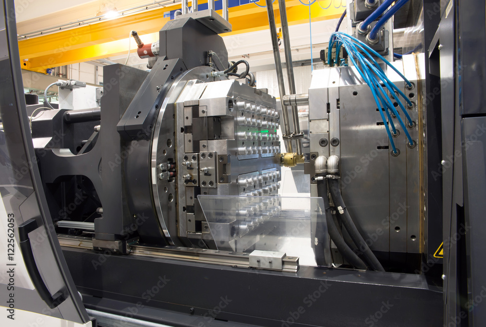 Injection molding machines in a large factory Injection molding machines in a large factory