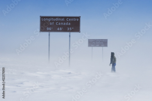 signage along Trans-Canada Highway east of Winnipeg during winter, Manitoba, Canada photo