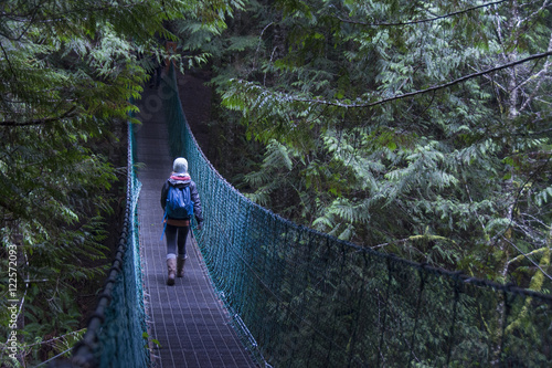 Suspension bridge and hikers Juan de Fuca trail near China Beach, near  Victoria, BC,  Canada photo