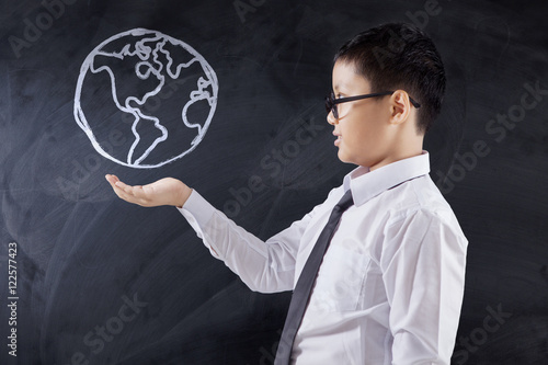 Boy holds a globe icon