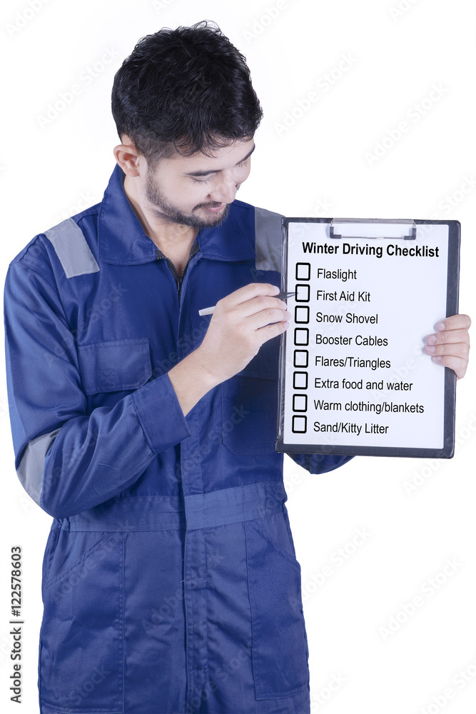 Male mechanic shows winter driving tips Male mechanic shows winter driving tips