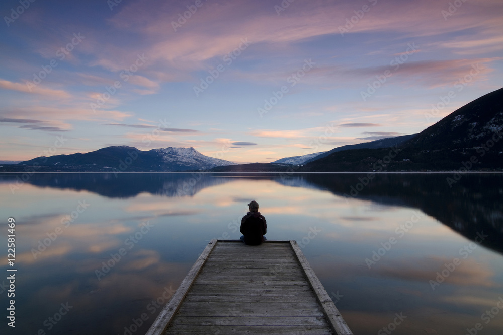 Taking in the sunset colours over Shuswap Lake in Sunnybrae, near Salmon Arm, British Columbia, Canada. MR102 Taking in the sunset colours over Shuswap Lake in Sunnybrae, near Salmon Arm, British Columbia, Canada. MR102