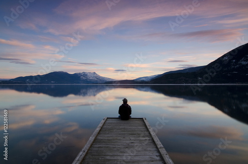 Taking in the sunset colours over Shuswap Lake in Sunnybrae, near Salmon Arm, British Columbia, Canada. MR102