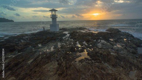 aerial view above light house tower in sunset time.light house was build on the rock near Nang Thong beach Khaolak Phang Nga province