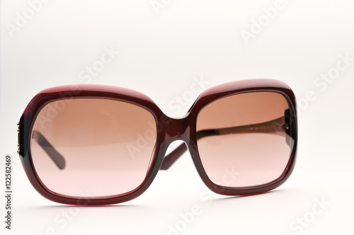Old sunglass, old style sunglass, red color, on white background, isolated