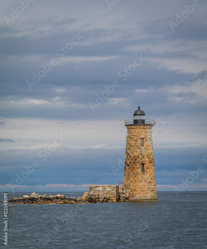 Whaleback Lighthouse in Kittery, Maine, on a cloudy foggy day in early Fall, portrait