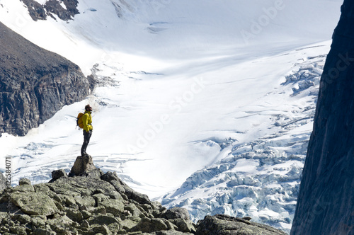 A hiker overlooks Bugaboo Glacier in Bugaboo Alpine Provincial Park, British Columbia photo