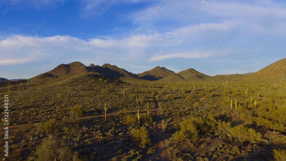 Aerial view of the desert mountain lanscape at sunset 