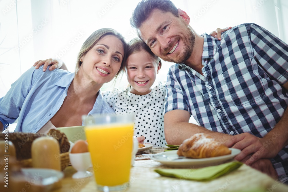 Portrait of happy family having breakfast together Portrait of happy family having breakfast together