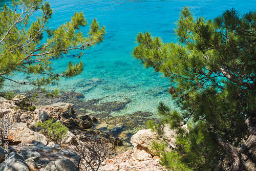 Mediterranean sea coast with clear sea water at Kastelorizo island on sunny day, Dodecanese, Greece
