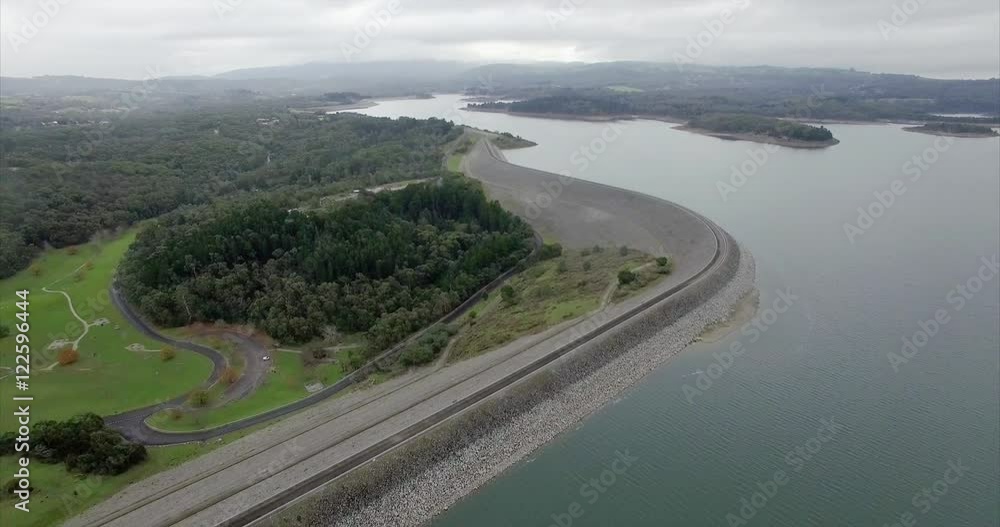 Backward flight over Cardinia Reservoir lake on gloomy day. Melbourne, Victoria, Australia. Backward flight over Cardinia Reservoir lake on gloomy day. Melbourne, Victoria, Australia.